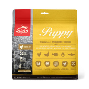 Orijen dry puppy food. Recipe for poultry, fish, organs, cartilage and bones. Choice of formats.